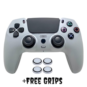 May include: A white PlayStation 5 controller with black buttons and analog sticks. Four white thumb grips are included. +FREE GRIPS
