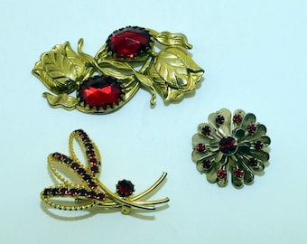3 Floral brooches/pins with red stones