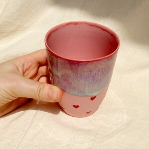 inside of pink porcelain mug flow glazes and red heartshand painted