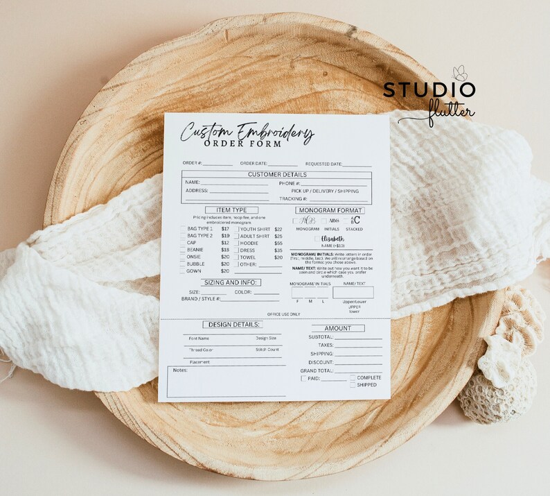 May include: A white order form for custom embroidery with the text "Custom Embroidery Order Form" at the top. The form includes sections for customer details, item type, sizing and info, design details, and amount. The form also includes a section for monogram format with the options "C", "ABM", "IC", "Stacked", and "Initials".