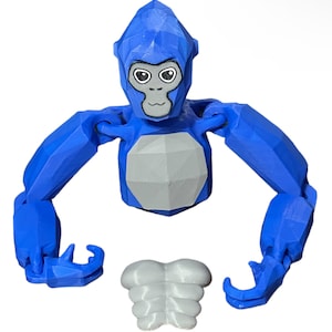 May include: A blue and gray 3D printed articulated toy monkey with a face and a separate torso piece.