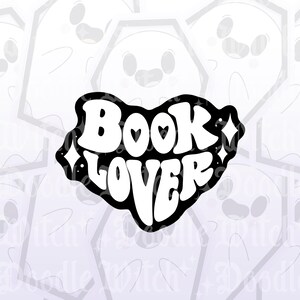 May include: A black and white sticker with the words "Book Lover" in a retro font. The word "Book" has a heart in place of the letter "O". The sticker has a black border with white stars and diamonds.