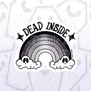 May include: A black and white sticker featuring a grayscale rainbow with the words "DEAD INSIDE" in bold letters. Two cartoon ghost-like clouds are at the bottom of the rainbow. The sticker has a glossy finish.