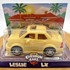 Vintage Chevron Cars LESLIE LX Yellow Sedan, Eyes 1998 NEW