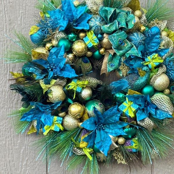 Corona navideña de pavo real: flores de Pascua azules, decoración navideña para la puerta de entrada