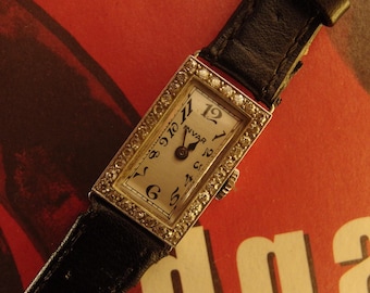 4447 Exquisite Platinum, 18K gold and Natural Diamonds (0.70ct) rectangular wrist watch for ladies, circa 1930