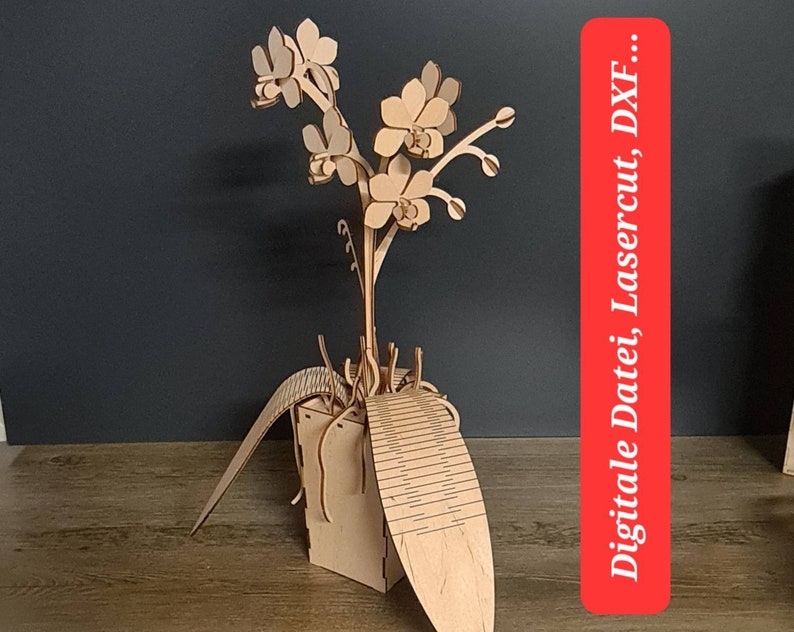 Peut inclure: Mod&egrave;le de fleur d'orchid&eacute;e en bois avec un design d&eacute;taill&eacute;. La fleur est dans un pot avec une base d&eacute;corative. L'image comprend le texte "Digitale Datei, Lasercut DXF..."