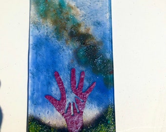 Reaching out to aliens  in fused glass made in Cornwall UK