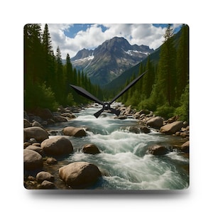 May include: Square wall clock featuring a scenic landscape of a river flowing through a mountain valley. The clock face displays a photograph of a river with large rocks, surrounded by green trees and mountains under a blue sky. Black clock hands indicate the time.