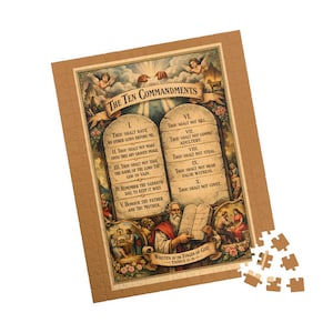 May include: A jigsaw puzzle featuring a detailed illustration of the Ten Commandments. The image includes text, angels, and figures, with a tan border and a few loose pieces. The puzzle depicts a religious theme.