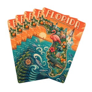 May include: A stack of Florida-themed postcards. Each postcard features a colorful illustration of the state's map, with a flamingo, alligator, and other iconic imagery. The text "FLORIDA - THE SUNSHINE STATE" is displayed at the top.