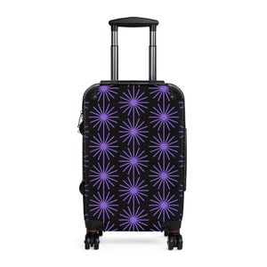 One of a Kind Black Suitcase Adorned with Eye-catching Purple Graphic Pattern