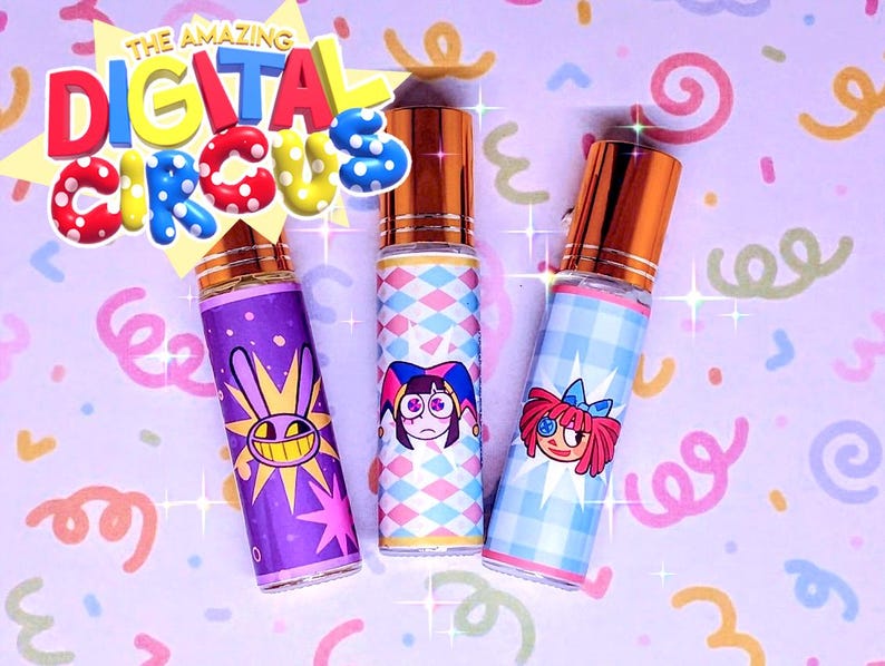 May include: Three perfume bottles with gold lids and vibrant labels. The labels display cartoon characters and the text "THE AMAZING DIGITAL CIRCUS". The background is a light purple with colourful confetti and swirls.