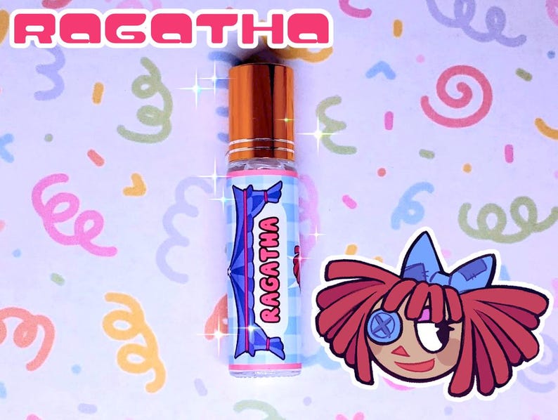 May include: A perfume roll-on bottle with a copper cap and a label reading "RAGATHA" in pink. The label features a blue and white checkered pattern and a cartoon doll illustration. The background is light purple with colourful swirls.