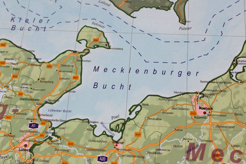 May include: A map of the Mecklenburg Bay, a body of water in northern Germany. The map shows the coastline, major cities, and towns, including Rostock, Wismar, and L&uuml;beck. The map also shows the names of the surrounding bodies of water, including the Baltic Sea, the Kieler Bucht, and the Lubecker Bucht.