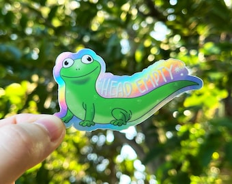 Pegatina divertida del meme de tolvas holográficas vacías con cabeza de Tom el lagarto