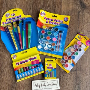 May include: A set of art supplies for kids, including 15 assorted paint brushes, 19 poster paints and brushes, 10 glitter glues, 12 chalks, and a sign that says "Arty Kids Creations - Play - Paint - Create".