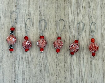 Set of red wire loop stitch markers with BOR marker