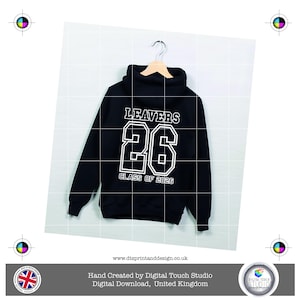 May include: Black hoodie with the word "LEAVERS" above the number "26" and "CLASS OF 2026" in white block letters. The sweatshirt is suspended on a wooden hanger. The website address is visible.
