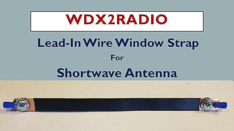 May include: A black Lead-In Wire Window Strap for Shortwave Antenna. The strap has a copper base with a black strap and is secured with silver screws and blue plastic ends. The text "WDX2RADIO" is at the top.