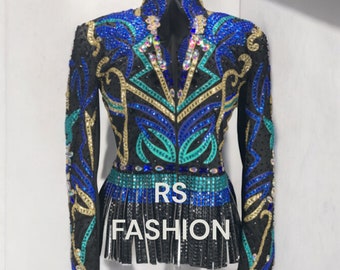 May include: A black show jacket with a blue, green, and gold design. The jacket has a fringe trim and is embellished with rhinestones. The text "RS FASHION" is printed on the front of the jacket.