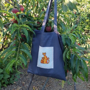 Sac de marché en toile avec famille chat orange