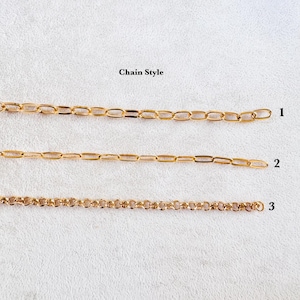 May include: Three gold-toned metal chains arranged horizontally, labeled 1, 2, and 3. Chain 1 features elongated oval links, chain 2 has thinner elongated oval links, and chain 3 consists of small, round, interconnected circular links.