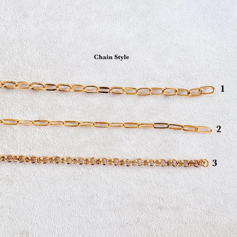 May include: Three gold-toned metal chains arranged horizontally, labeled 1, 2, and 3. Chain 1 features elongated oval links, chain 2 has thinner elongated oval links, and chain 3 consists of small, round, interconnected circular links.