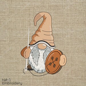 May include: Embroidered gnome with a brown hat, white beard, and a large brown button in its hand.
