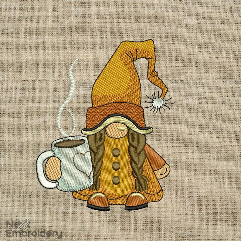 May include: Embroidered design of a gnome holding a white mug with a brown liquid and steam coming from it. The gnome is wearing a brown hat with a yellow brim, a yellow coat, and brown braids. The background is a brown burlap fabric.