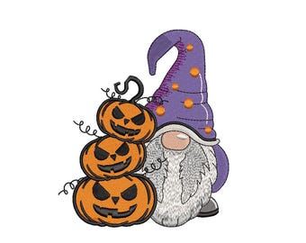 May include: A Halloween-themed embroidery design featuring a gnome with a long white beard and a purple hat adorned with orange dots. Three stacked jack-o'-lanterns with carved faces are next to the gnome. The design is set against a white background.
