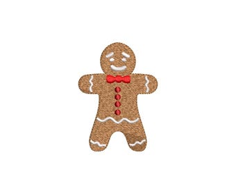 Peut inclure: Motif de broderie de bonhomme en pain d'épices marron avec un nœud papillon rouge, des détails de glaçage blanc et un visage souriant. Le motif a un aspect texturé et convient aux projets de Noël.