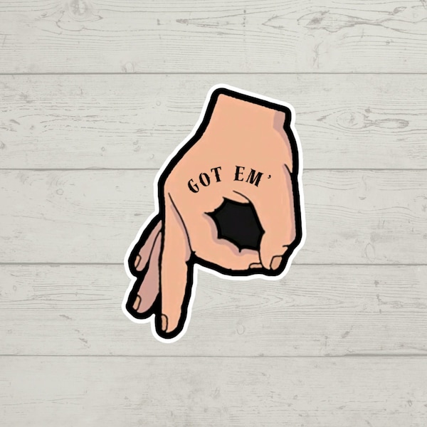 A handmade Got Em hand sign sculpture