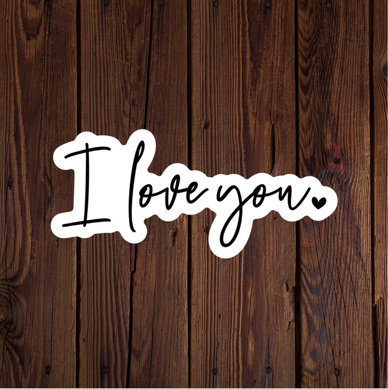 May include: White sticker with black script that reads "I love you" with a small heart symbol.