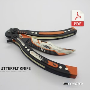 May include: A black and orange butterfly knife with a white and orange blade. The knife is open and the blade is extended. The knife has a black handle with white accents. The knife is on a white background. The text "BUTTERFLYT KNIFE" is printed below the knife. The text "ORIGINAL COPY RIGHTED MATERIAL" is printed below the text "BUTTERFLYT KNIFE".