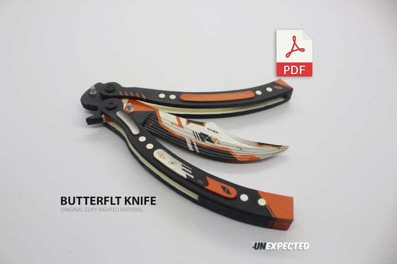 May include: A black and orange butterfly knife with a white and orange blade. The knife is open and the blade is extended. The knife has a black handle with white accents. The knife is on a white background. The text "BUTTERFLYT KNIFE" is printed below the knife. The text "ORIGINAL COPY RIGHTED MATERIAL" is printed below the text "BUTTERFLYT KNIFE".