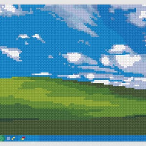 May include: Cross-stitch depicting the Windows XP desktop background. A blue sky with white clouds dominates the top, above a green hill. The bottom edge shows a blue bar with various icons.