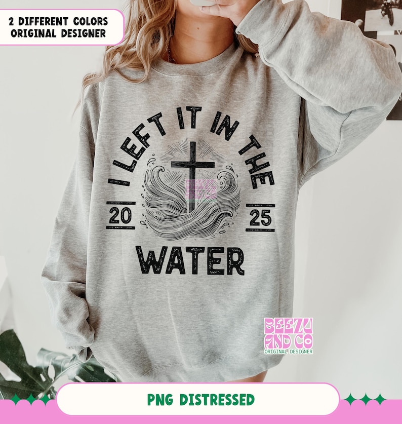 May include: A gray sweatshirt with a distressed black graphic design that reads "I Left It In The Water" with a cross and waves. The graphic also includes the numbers 20 and 25.