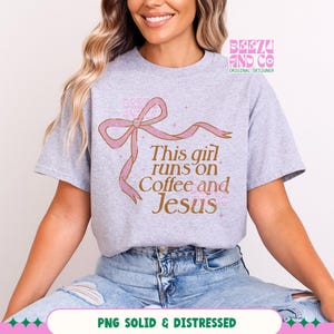 May include: A gray t-shirt with a pink ribbon and the text "This girl runs on Coffee and Jesus".