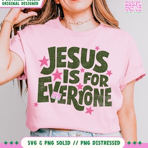 May include: A light pink t-shirt with the text "JESUS IS FOR EVERYONE" in dark green letters and pink stars. The shirt also has the text "3 DIFFERENT COLORS ORIGINAL DESIGNER" and "SVG & PNG SOLID // PNG DISTRESSED".