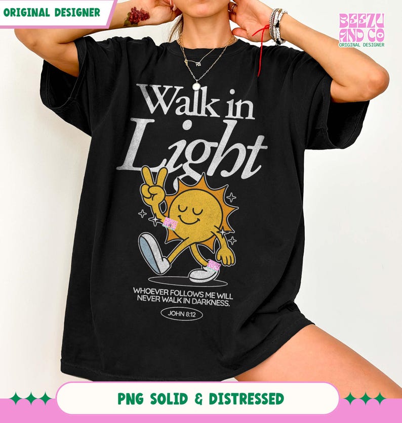 May include: Black t-shirt with the text "Walk in Light" in silver lettering. A cartoon sun character with a peace sign and the quote "Whoever follows me will never walk in darkness. John 8:12" is also featured.