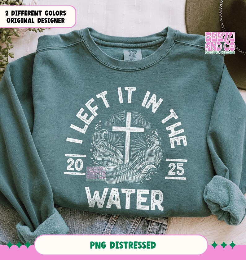May include: A teal blue sweatshirt with a white distressed graphic that says "I Left It In The Water" with a cross and waves. The graphic also includes the numbers 20 and 25.