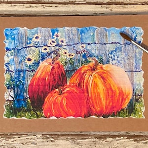 Tarjeta de otoño hecha a mano, pintada a mano, con calabazas y tintas de alcohol.