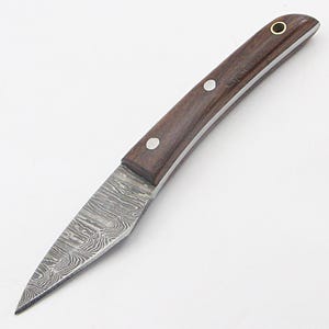 May include: A small, hand-crafted knife with a dark wood handle and a patterned steel blade.
