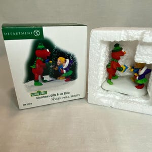 Department 56 - Christmas Gifts from Elmo - North Pole Series Village Collection - Christmas Village Building - #56.57216