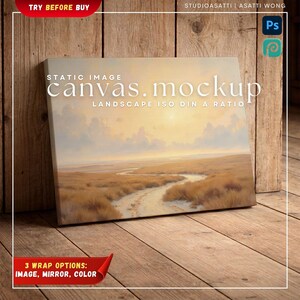 Op de afbeelding: Een canvas mockup met een landschapsschilderij met een kronkelend pad door een veld onder een zonsonderganghemel. Het canvas toont de tekst "canvas.mockup" en "LANDSCAPE ISO DIN A RATIO". De afbeelding staat tegen een houten achtergrond.