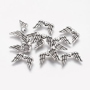 100 Pz Vendita Bulk Tibetano Antico Argento Colore Angelo Fairy Wings Distanziatore Perline Charms