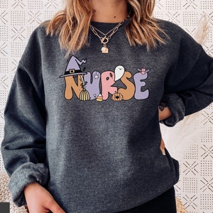 Retro Nurse Halloween Sweatshirt, Cute Spooky Retro Nurse Sweater, RN LPN Crna Pacu Er Ed Icu Critical Care Nurse Sweatshirt Gift