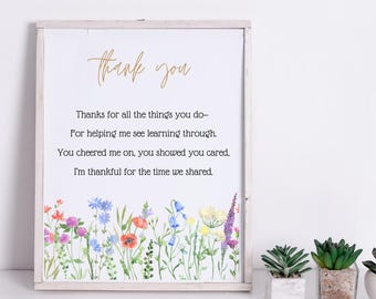 May include: A white framed print with a floral border and a poem that reads "thank you" and "Thanks for all the things you do- For helping me see learning through. You cheered me on, you showed you cared, I'm thankful for the time we shared."
