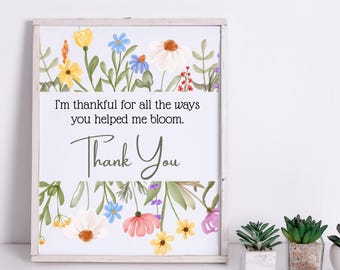 May include: A white framed print with a floral design and the text "I'm thankful for all the ways you helped me bloom. Thank You".